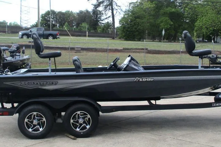Slide: The Image of 2026 Ranger RT198P fishing boat on trailer, parked outdoors. - 8