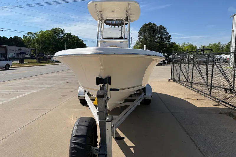 Slide: The Image of 2017 Key West 219 FS boat on trailer, parked outdoors on a sunny day. - 11