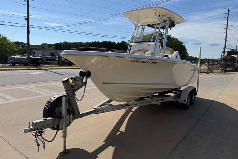 Slide: The Image of 2017 Key West 219 FS boat on trailer in outdoor setting. - 12