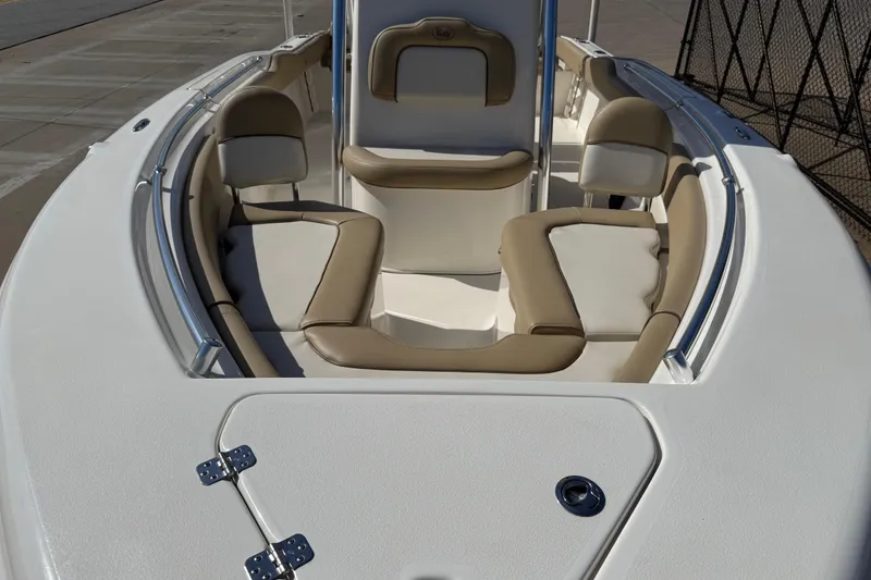 Slide: The Image of 2017 Key West 219 FS boat interior with beige seating and white deck. - 18