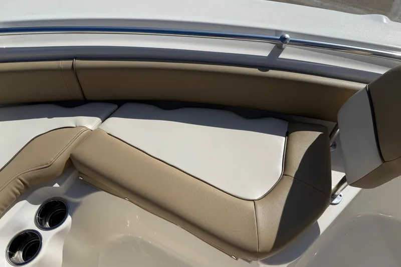 Slide: The Image of 2017 Key West 219 FS boat interior with beige seating and stainless steel cup holders. - 22