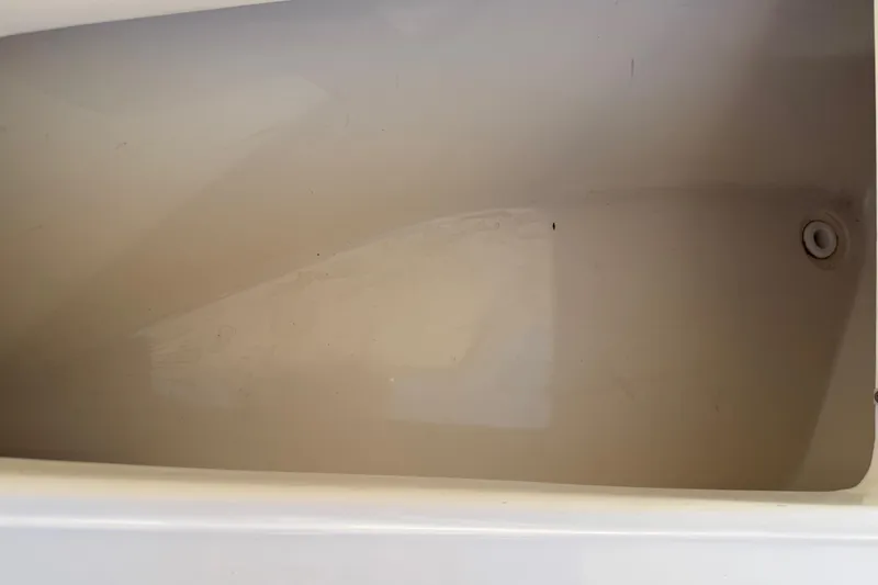 Slide: The Image of Empty storage compartment in 2017 Key West 219 FS boat. - 23