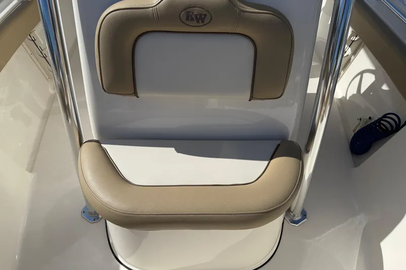 Slide: The Image of 2017 Key West 219 FS boat seat with beige cushions and stainless steel frame. - 24