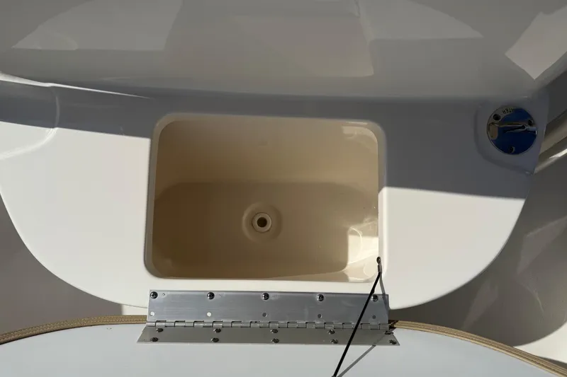 Slide: The Image of 2017 Key West 219 FS boat compartment with open hatch and water inlet. - 25