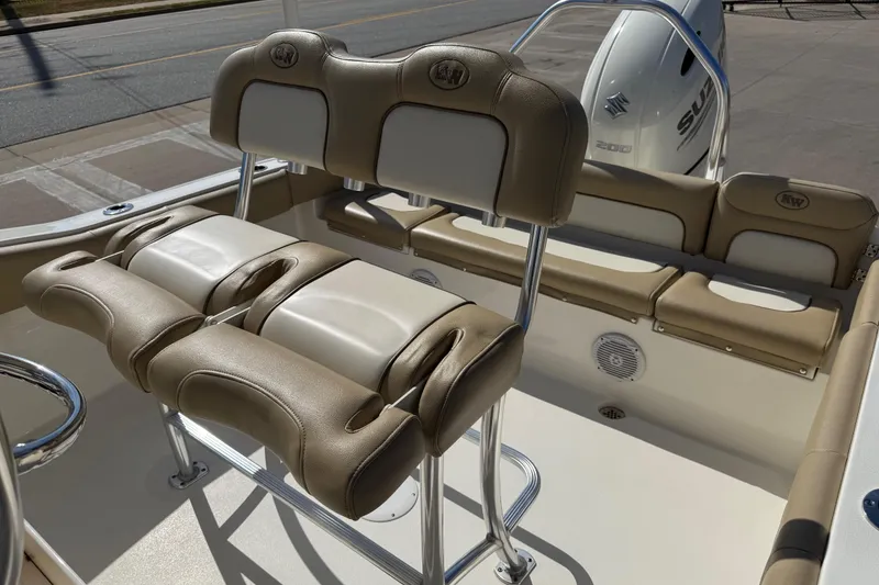Slide: The Image of 2017 Key West 219 FS boat interior with beige seating and Suzuki engine. - 26