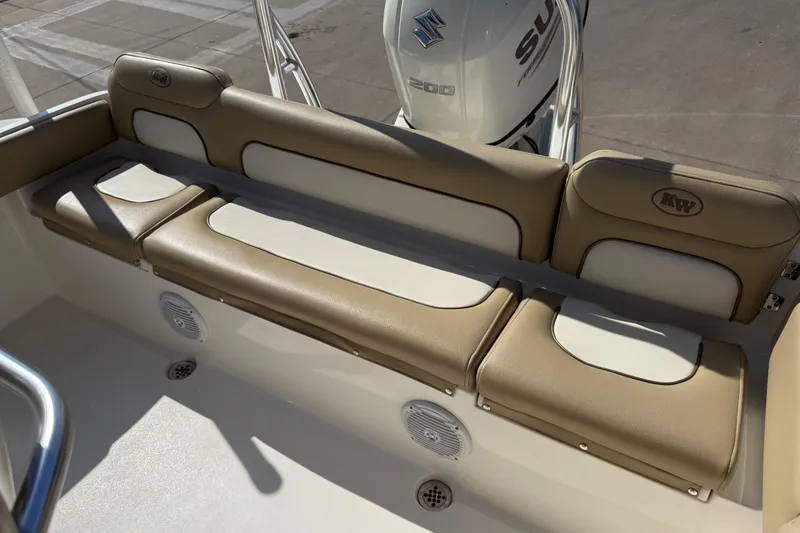 Slide: The Image of 2017 Key West 219 FS boat seating with beige and white cushions, Suzuki engine visible. - 27
