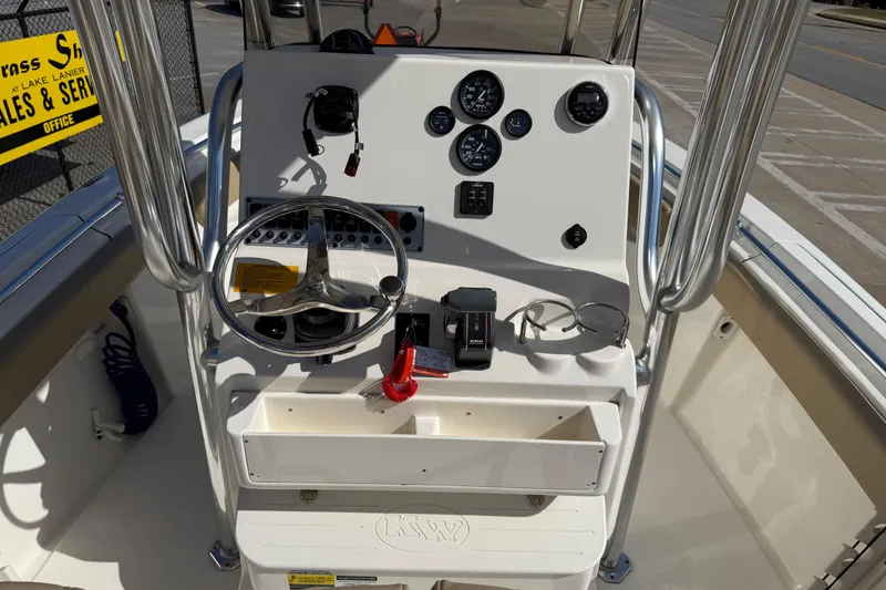 Slide: The Image of 2017 Key West 219 FS boat console with steering wheel and gauges. - 29