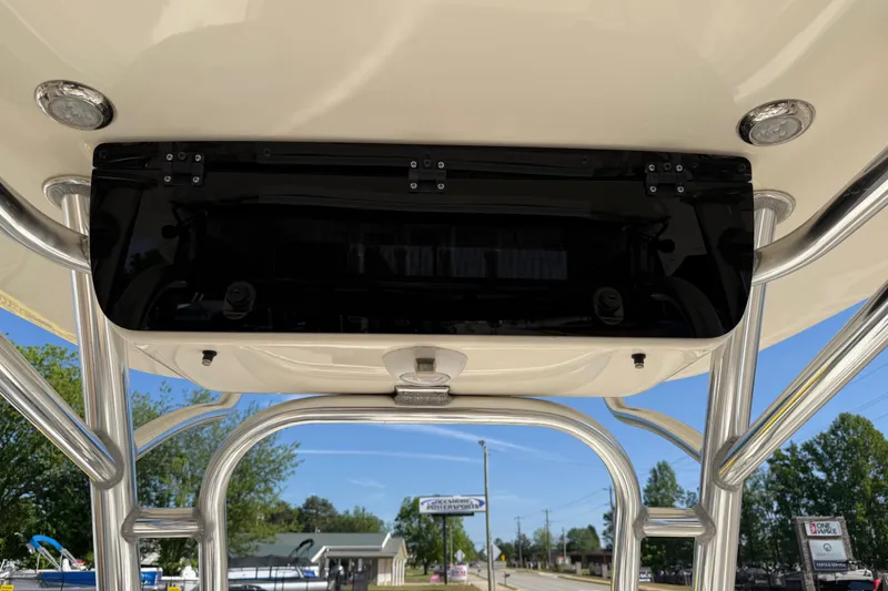 Slide: The Image of 2017 Key West 219 FS boat T-top with rod holders and electronics box. - 30