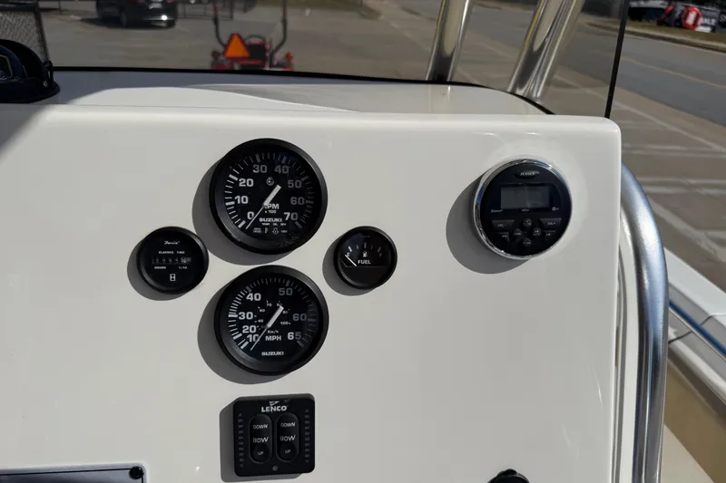 Slide: The Image of Dashboard of 2017 Key West 219 FS boat with gauges and controls. - 34