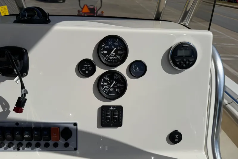 Slide: The Image of Dashboard of a 2017 Key West 219 FS boat with gauges and controls. - 36