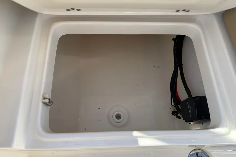 Slide: The Image of Storage compartment of a 2017 Key West 219 FS boat with wiring visible. - 39
