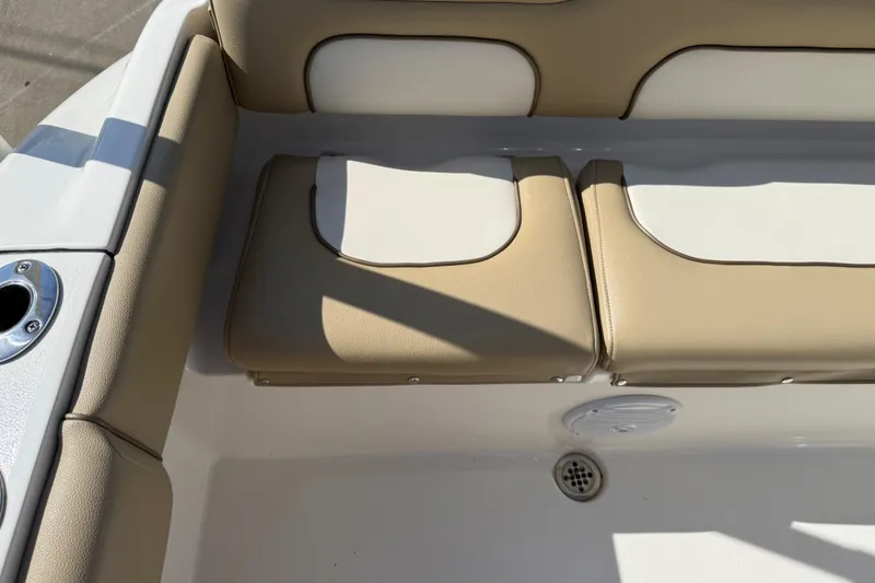 Slide: The Image of 2017 Key West 219 FS boat seating area with tan cushions and cup holder. - 40