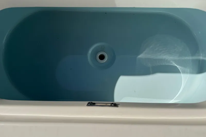 Slide: The Image of 2017 Key West 219 FS boat livewell, top view, blue interior. - 41