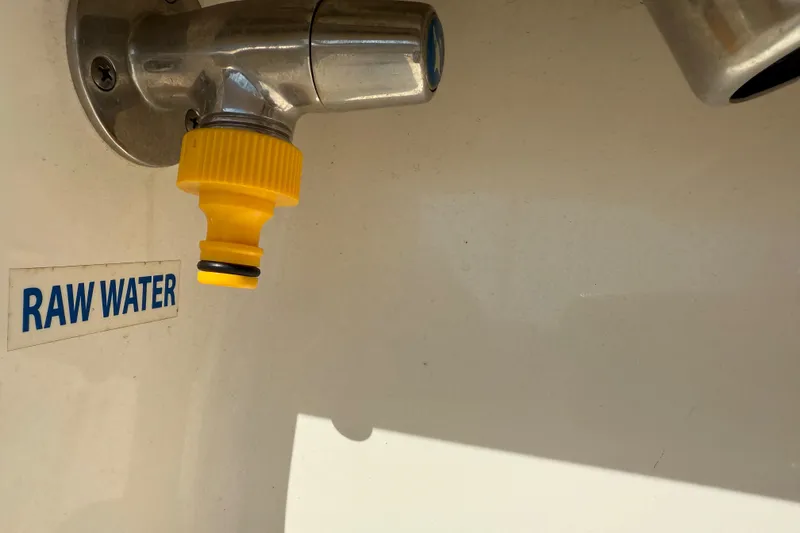 Slide: The Image of 2017 Key West 219 FS boat raw water outlet with yellow connector. - 45