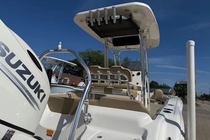 Slide: The Image of 2017 Key West 219 FS boat with Suzuki engine, viewed from the rear under clear blue sky. - 51