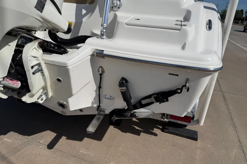 Slide: The Image of Rear view of a 2017 Key West 219 FS boat showing motor and support details. - 52