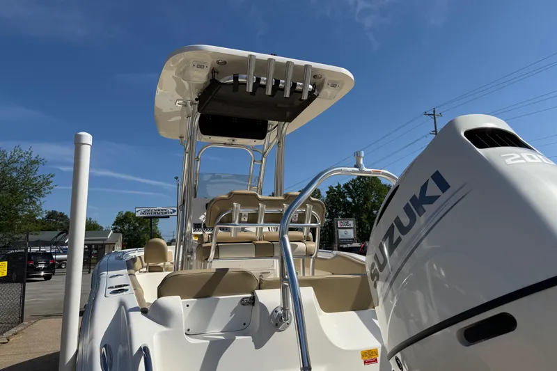 Slide: The Image of 2017 Key West 219 FS boat with Suzuki engine under clear blue sky. - 54