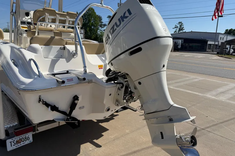 Slide: The Image of 2017 Key West 219 FS boat with Suzuki outboard motor on a trailer. - 55
