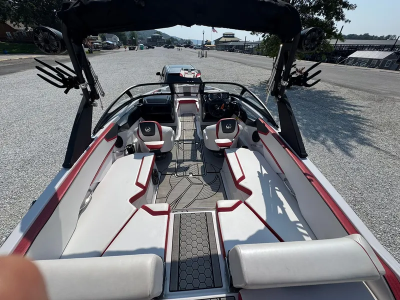 Slide: The Image of Interior of a 2018 Scarab 215 ID boat with red accents. - 11