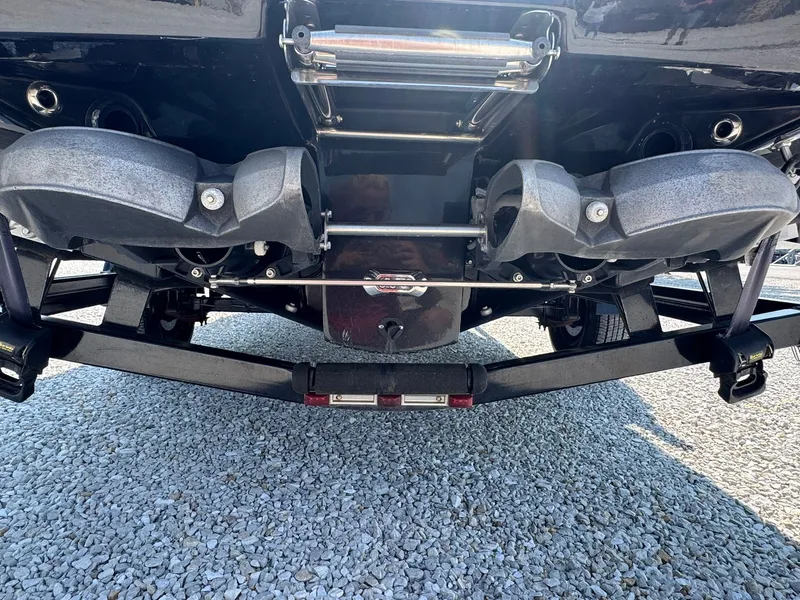 Slide: The Image of Rear view of a 2018 Scarab 215 ID boat on trailer. - 16