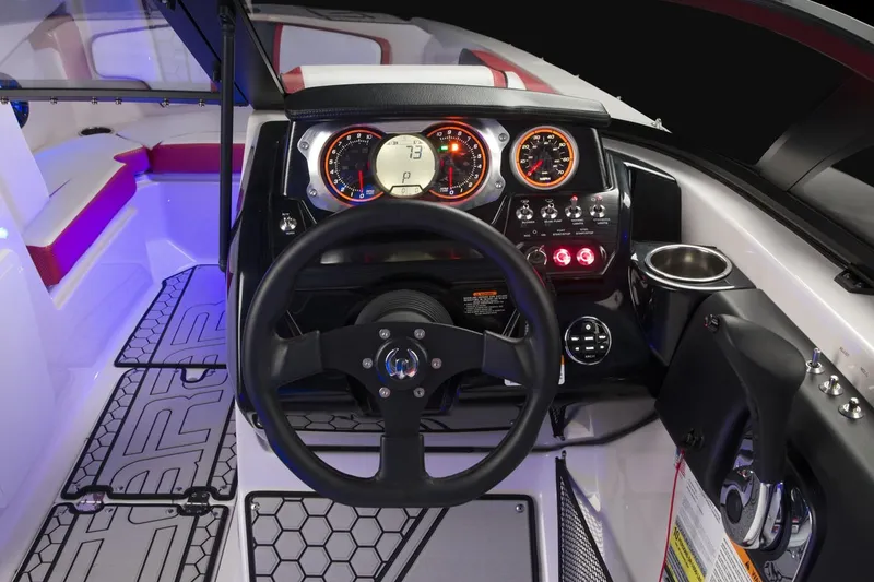 Slide: The Image of Interior view of 2018 Scarab 215 ID boat cockpit. - 27