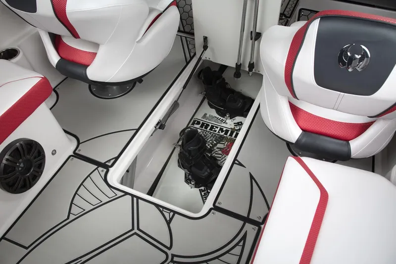 Slide: The Image of Interior of 2018 Scarab 215 ID with storage and red seats. - 30