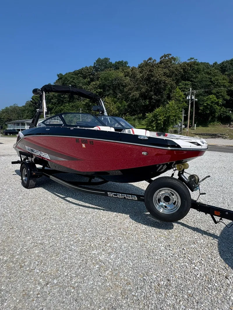 Slide: The Image of 2018 Scarab 215 ID boat on trailer, red design. - 5