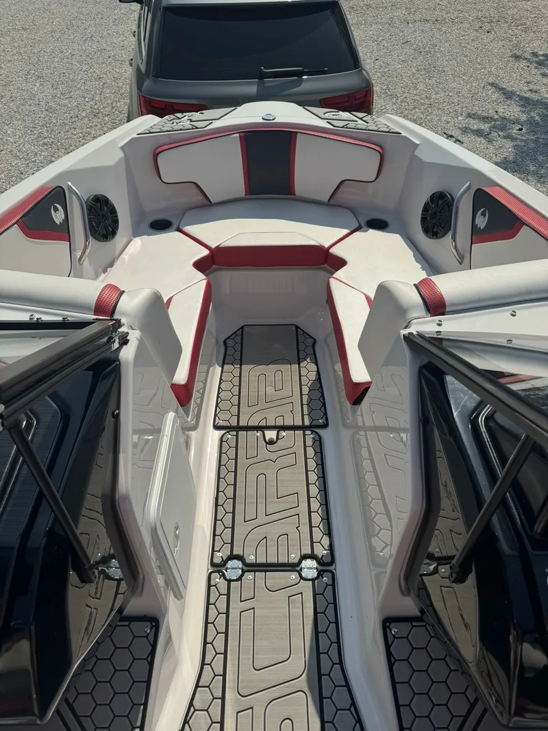 Slide: The Image of Interior of a 2018 Scarab 215 ID boat with red accents. - 7