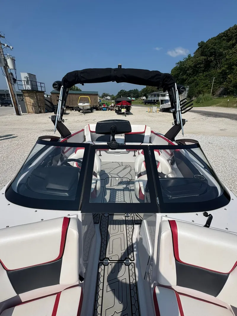 Slide: The Image of 2018 Scarab 215 ID boat with sleek design and red accents. - 9