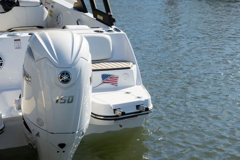 Slide: The Image of 2026 Stingray 20 SBX boat with Yamaha 150 engine on water. - 8