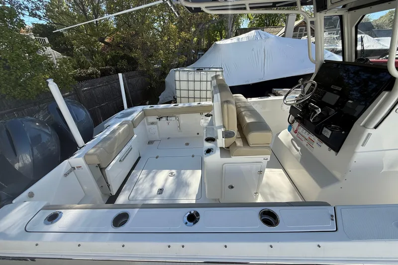 Slide: The Image of 2021 Pursuit S 268 Sport boat interior with seating and control panel. - 9