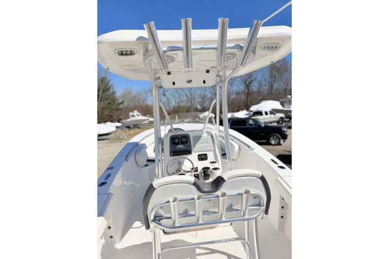 Slide: The Image of 2015 Tidewater 230 CC Adventure boat console with T-top and rod holders. - 10
