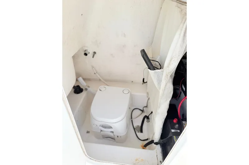 Slide: The Image of Interior of 2015 Tidewater 230 CC Adventure boat with portable toilet. - 13