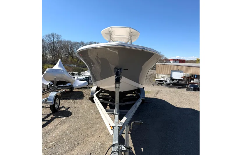 Slide: The Image of 2015 Tidewater 230 CC Adventure boat on trailer, outdoor setting. - 3