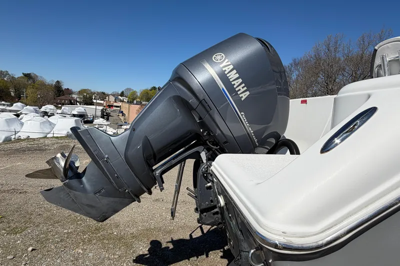 Slide: The Image of 2015 Tidewater 230 CC Adventure with Yamaha outboard motor in a boatyard. - 5