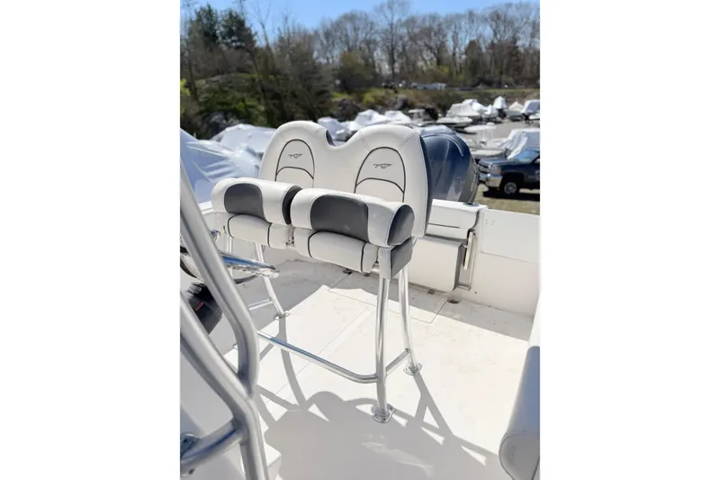 Slide: The Image of 2015 Tidewater 230 CC Adventure boat with dual cushioned seats and stainless steel frame. - 7