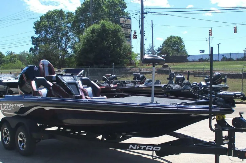 Slide: The Image of 2026 Nitro Z20 XL Pro bass boat on trailer, parked outdoors. - 10