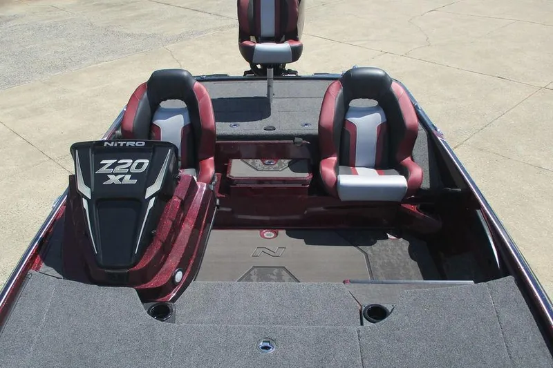 Slide: The Image of 2026 Nitro Z20 XL Pro boat interior with red and gray seating, showcasing spacious design. - 12