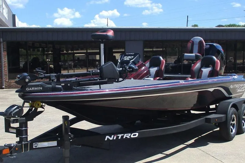 Slide: The Image of 2026 Nitro Z20 XL Pro fishing boat on trailer, featuring Garmin equipment. - 6