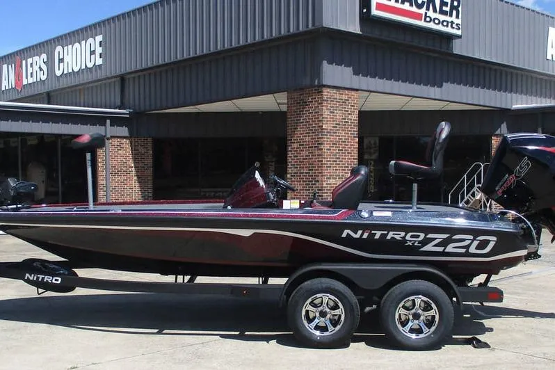 Slide: The Image of 2026 Nitro Z20 XL Pro boat displayed outside Anglers Choice store. - 7