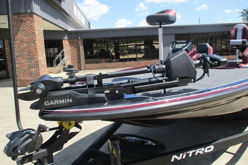 Slide: The Image of 2026 Nitro Z20 XL Pro boat with Garmin equipment, parked outside a brick building. - 8