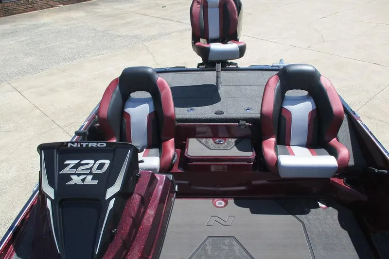 Slide: The Image of 2026 Nitro Z20 XL Pro boat interior with red and black seating, showcasing modern design. - 9