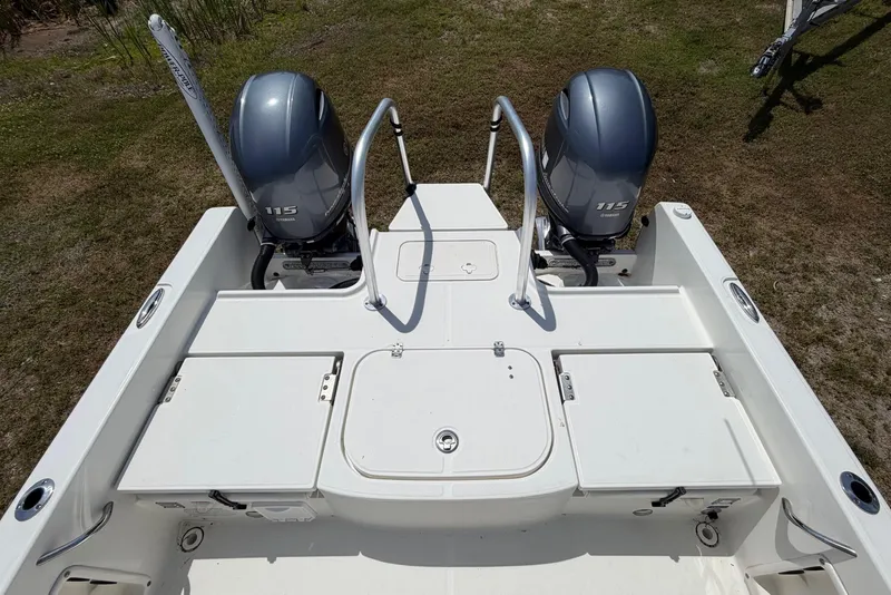 Slide: The Image of 2019 World Cat 230 CC boat with dual Yamaha 115 engines, viewed from above. - 26