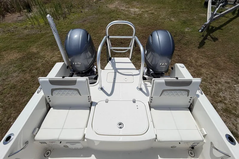 Slide: The Image of 2019 World Cat 230 CC boat with twin Yamaha 115 engines, rear seating view. - 28