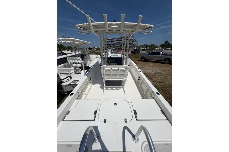 Slide: The Image of 2019 World Cat 230 CC boat interior with seating and storage compartments. - 29