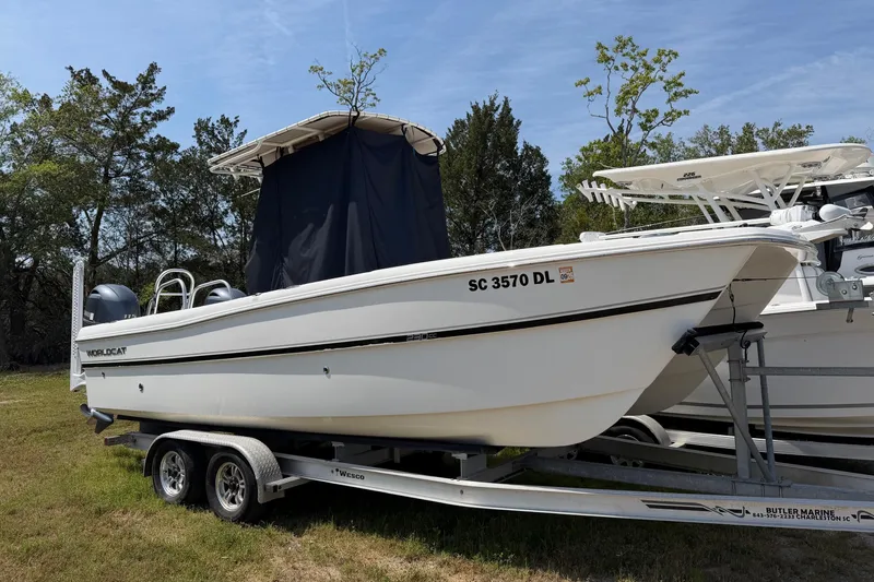 Slide: The Image of 2019 World Cat 230 CC boat on trailer, parked outdoors. - 33
