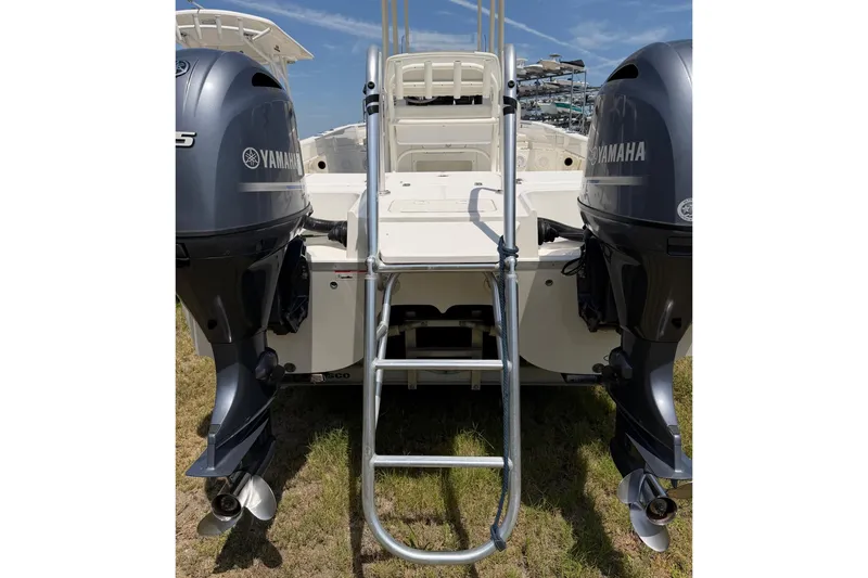 Slide: The Image of 2019 World Cat 230 CC boat with dual Yamaha engines and rear ladder. - 34