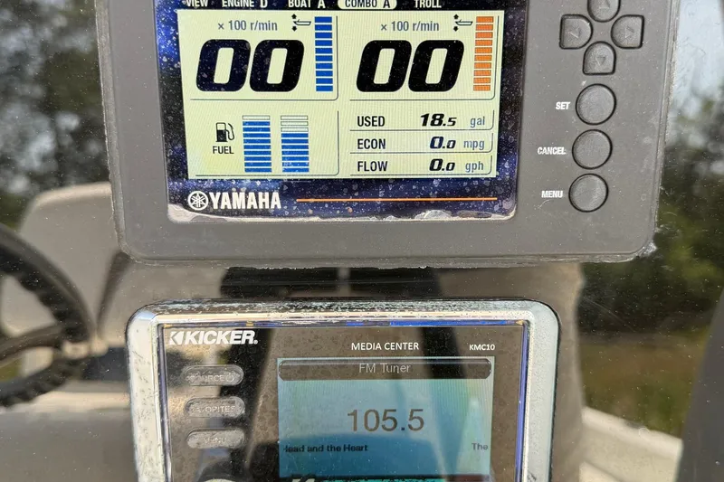Slide: The Image of Yamaha boat display showing fuel usage and Kicker media center on World Cat 230 CC. - 36