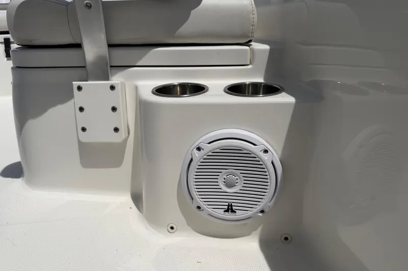 Slide: The Image of 2019 World Cat 230 CC boat interior with cup holders and speaker. - 39