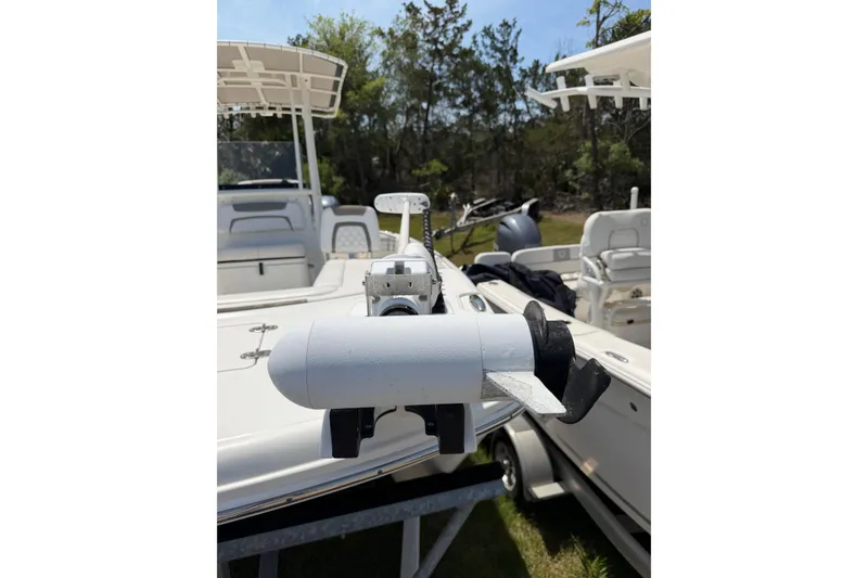 Slide: The Image of 2019 World Cat 230 CC boat with trolling motor on trailer, outdoors. - 46
